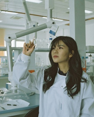 Scientist holding up a sample in a laboratory